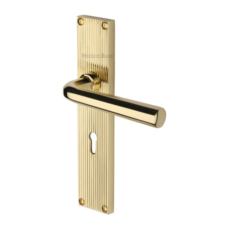 This is an image of a Heritage Brass - Octave Reeded Lever Lock Polished Brass finish, rr3700-pb that is available to order from T.H Wiggans Ironmongery in Kendal.