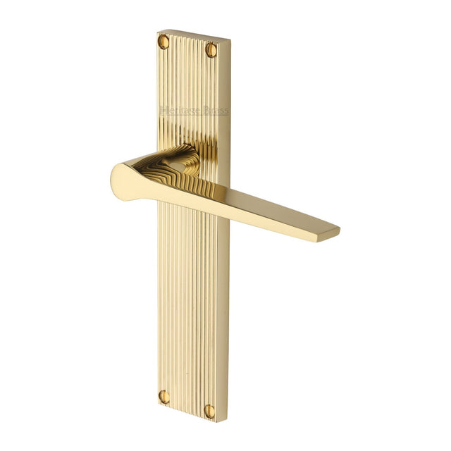 This is an image of a Heritage Brass - Gio Reeded Lever Latch Polished Brass finish, rr4710-pb that is available to order from T.H Wiggans Ironmongery in Kendal.