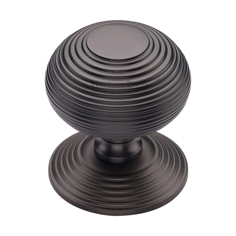 This is an image of a Heritage Brass - Centre Door Knob Reeded Design 3 1/2 Matt Bronze Finish, rr906-mb that is available to order from T.H Wiggans Ironmongery in Kendal.