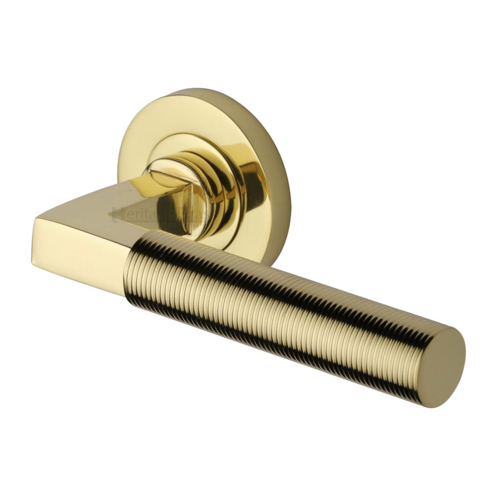 This is an image of a Heritage Brass - Door Handle Lever on Rose Spectral Design Polished Brass Finish, rs2261-pb that is available to order from T.H Wiggans Ironmongery in Kendal.