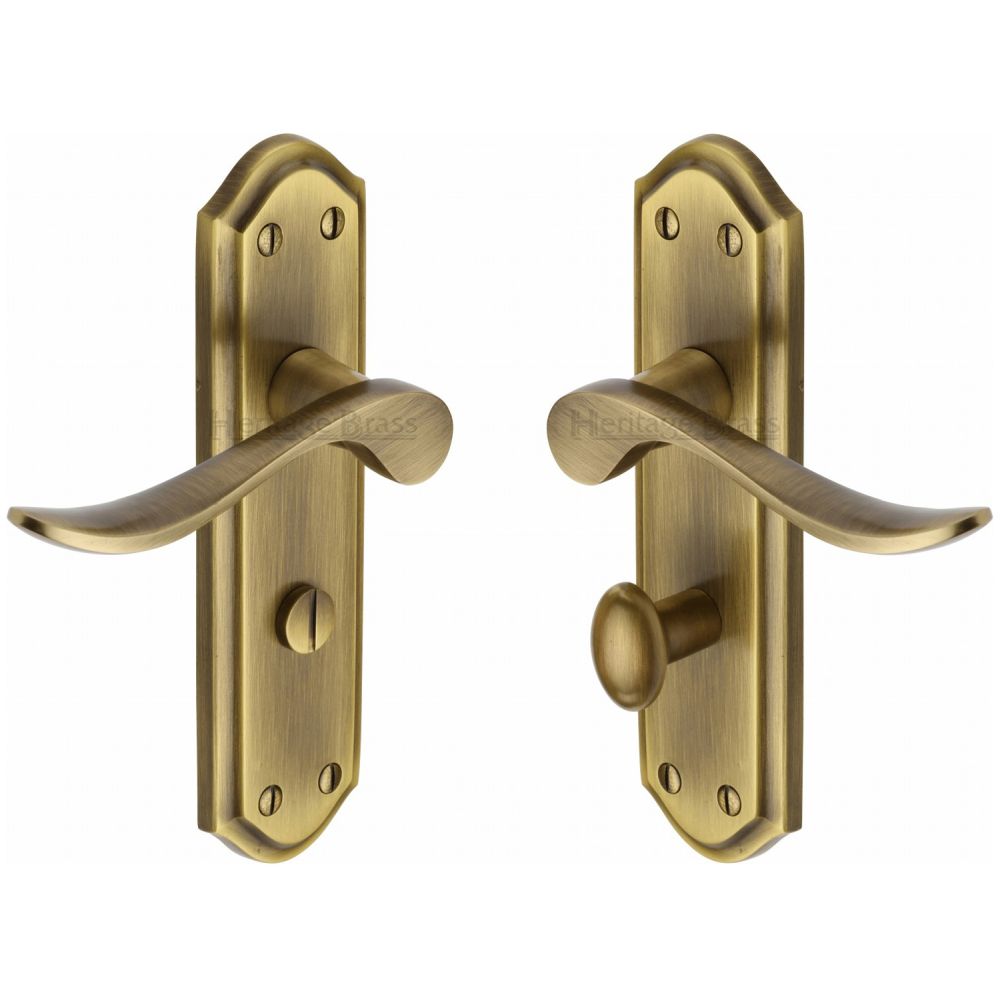 This is an image of a Heritage Brass - Door Handle for Bathroom Sandown Design Antique Brass Finish, san1430-at that is available to order from T.H Wiggans Ironmongery in Kendal.
