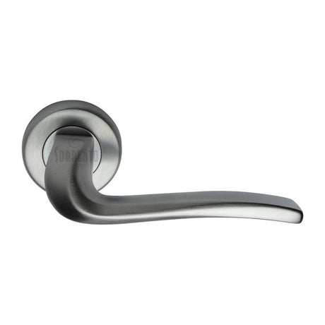 This is an image of a Sorrento - Door Handle Lever Latch on Round Rose Capri Design Satin Chrome Finish, sc-4262-sc that is available to order from T.H Wiggans Ironmongery in Kendal.