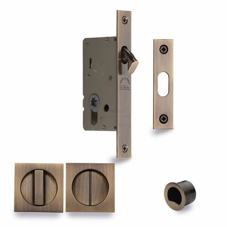 This is an image of a M.Marcus - SLD Lock C/W SQ Privacy Turns 40mm Antique Brass, sq2308-40-at that is available to order from T.H Wiggans Ironmongery in Kendal.