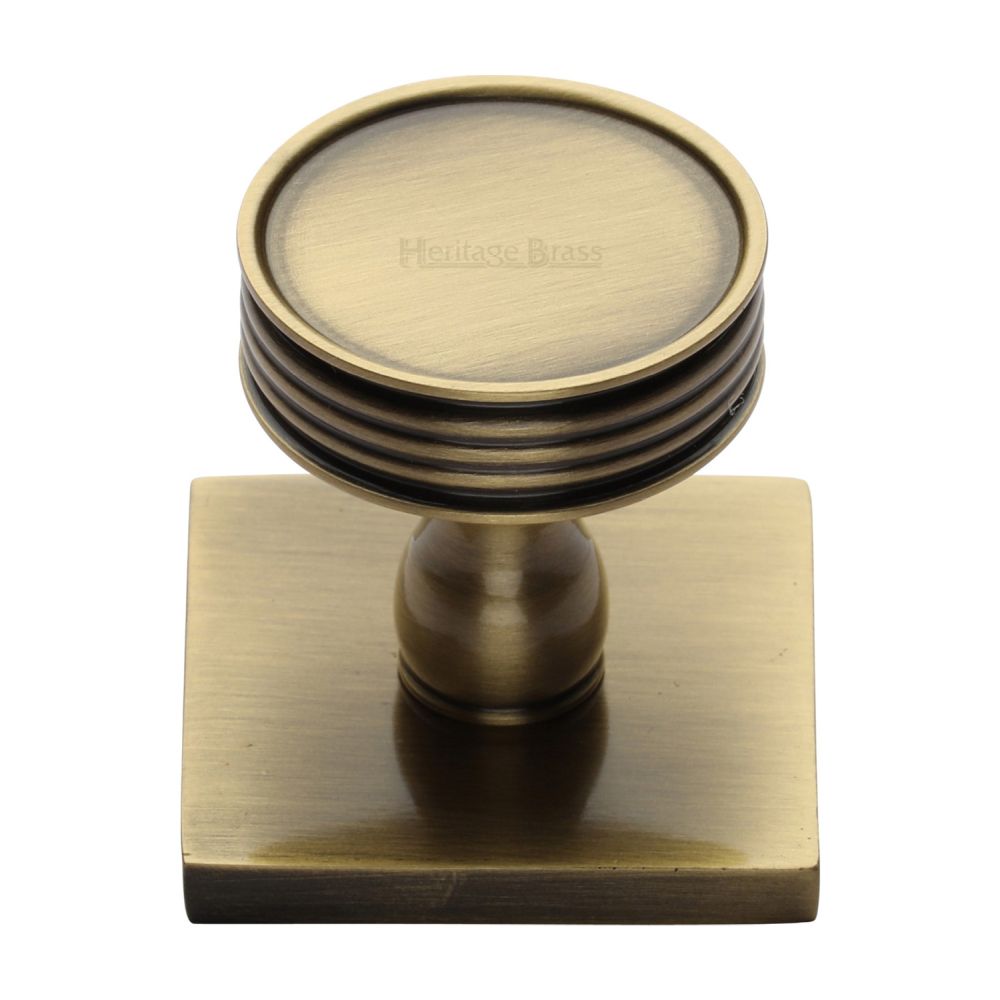 This is an image of a Heritage Brass - Cabinet Knob Venetian Design with Square Backplate 32mm Antique Br, sq4547-at that is available to order from T.H Wiggans Ironmongery in Kendal.