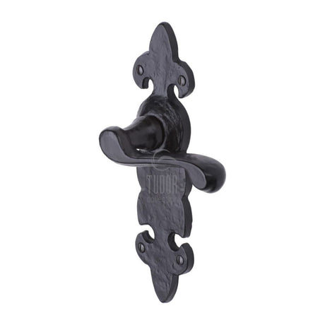 This is an image of a The Tudor Collection - Door Handle Lever Latch Fleur de Lys Design Black Iron, tc210 that is available to order from T.H Wiggans Ironmongery in Kendal.