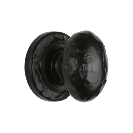 This is an image of a The Tudor Collection - Cabinet Knob Rustic Oval Design 32mm Black Iron, tc534-32 that is available to order from T.H Wiggans Ironmongery in Kendal.