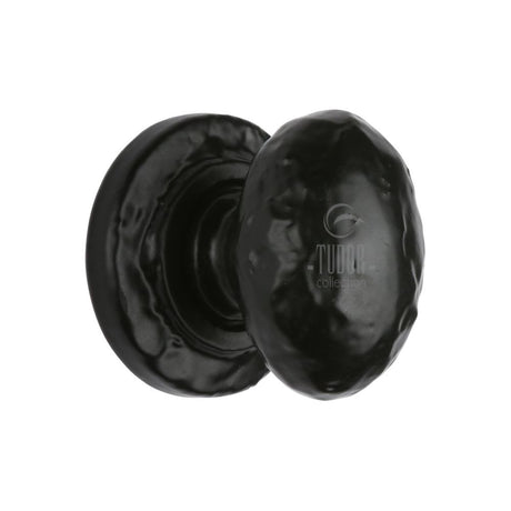 This is an image of a The Tudor Collection - Cabinet Knob Rustic Oval Design 38mm Black Iron, tc534-38 that is available to order from T.H Wiggans Ironmongery in Kendal.