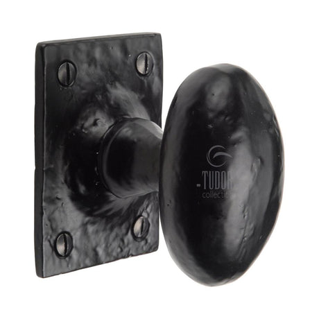 This is an image of a The Tudor Collection - Mortice Knob on Rose Oval Design Black Iron, tc550 that is available to order from T.H Wiggans Ironmongery in Kendal.