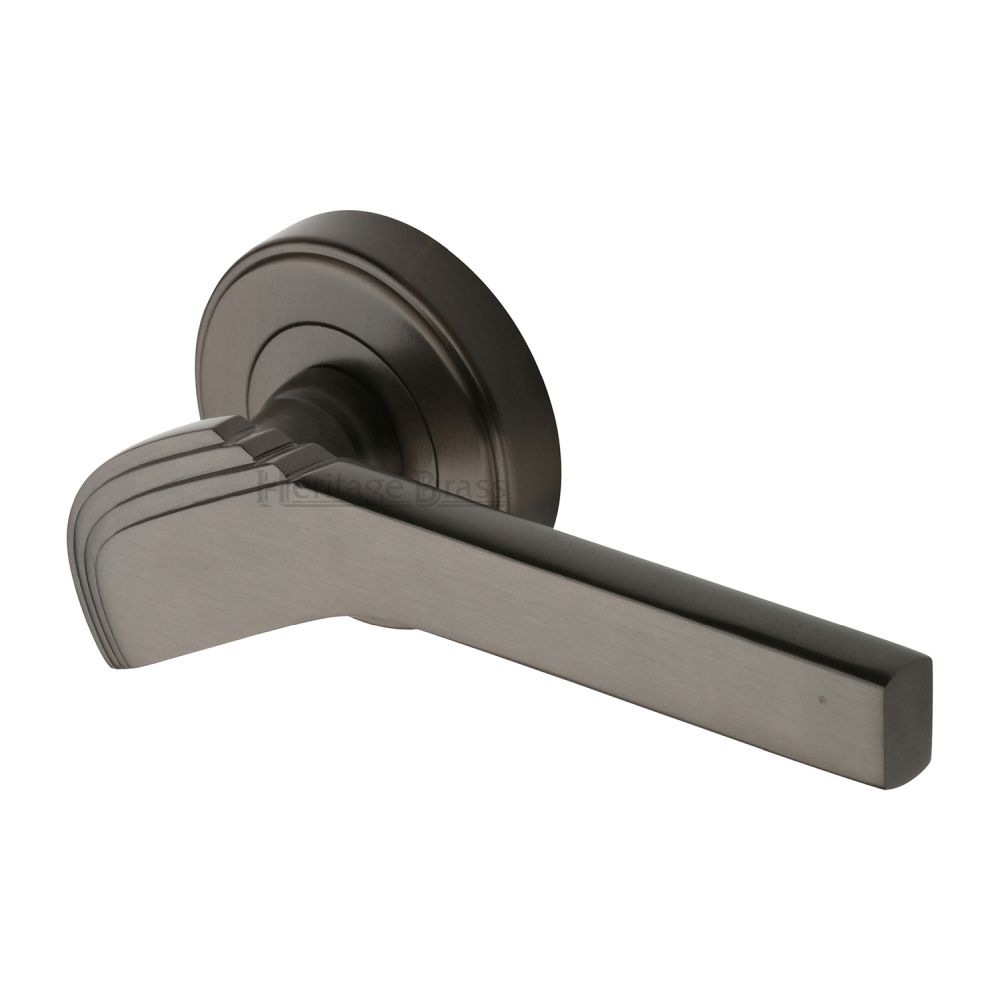 This is an image of a Heritage Brass - Door Handle Lever on Rose Tiffany Design Matt Bronze Finish, tif1926-mb that is available to order from T.H Wiggans Ironmongery in Kendal.