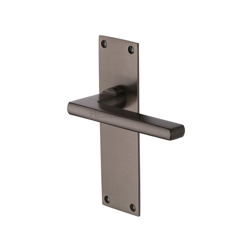 This is an image of a Heritage Brass - Door Handle Lever Latch Trident Design Matt Bronze Finish, tri1310-mb that is available to order from T.H Wiggans Ironmongery in Kendal.
