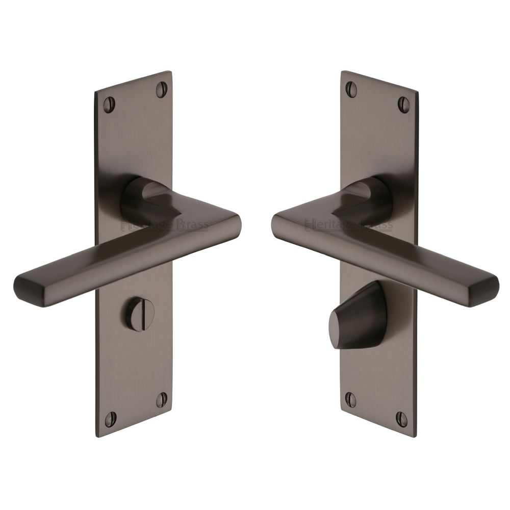 This is an image of a Heritage Brass - Door Handle Bathroom Set Trident Design Matt Bronze Finish, tri1330-mb that is available to order from T.H Wiggans Ironmongery in Kendal.