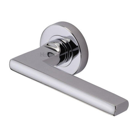 This is an image of a Heritage Brass - Door Handle Lever Latch on Round Rose Trident Design Polished Chrom, tri1352-pc that is available to order from T.H Wiggans Ironmongery in Kendal.