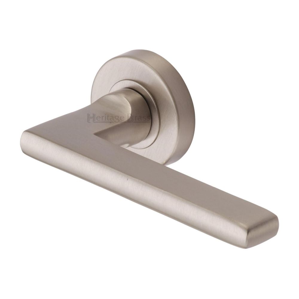 This is an image of a Heritage Brass - Door Handle Lever Latch on Round Rose Trident Design Satin Nicke, tri1352-sn that is available to order from T.H Wiggans Ironmongery in Kendal.