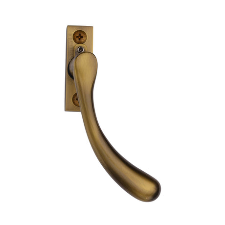 This is an image of a Heritage Brass - Right-Handed Espagnolette Handle Ball Design Antique Brass finish, v1009l-rh-at that is available to order from T.H Wiggans Ironmongery in Kendal.