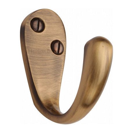 This is an image of a Heritage Brass - Single Robe Hook Antique Brass Finish, v1040-at that is available to order from T.H Wiggans Ironmongery in Kendal.