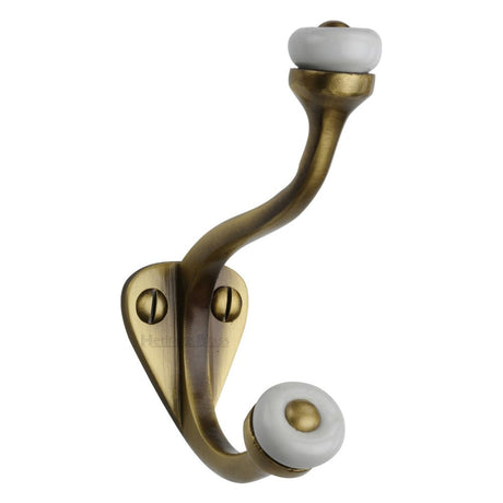 This is an image of a Heritage Brass - Hat & Coat Hook Antique Brass Finish, v1048-at that is available to order from T.H Wiggans Ironmongery in Kendal.