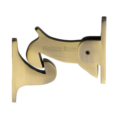 This is an image of a Heritage Brass - Door Holder Gravity Design Antique Brass Finish, v1074-at that is available to order from T.H Wiggans Ironmongery in Kendal.