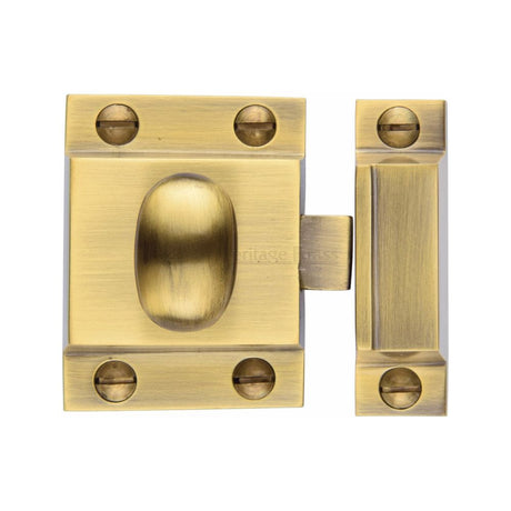 This is an image of a Heritage Brass - Cupboard Latch with Oval Turn Antique Brass Finish, v1112-at that is available to order from T.H Wiggans Ironmongery in Kendal.