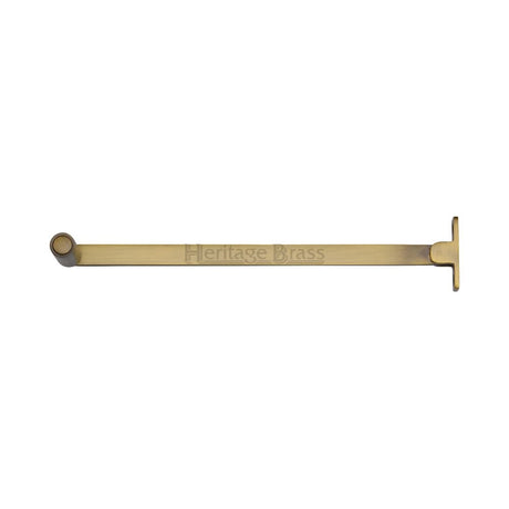 This is an image of a Heritage Brass - Roller Arm Stay 254mm Antique Brass Finish, v1119-10-at that is available to order from T.H Wiggans Ironmongery in Kendal.