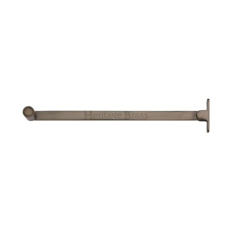 This is an image of a Heritage Brass - Roller Arm Stay 254mm Matt Bronze Finish, v1119-10-mb that is available to order from T.H Wiggans Ironmongery in Kendal.