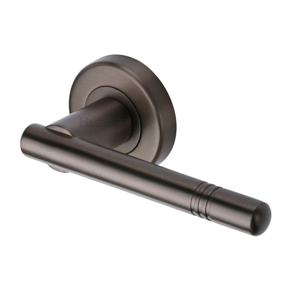 This is an image of a Heritage Brass - Door Handle Lever Latch on Round Rose Alicia Design Matt Bronze, v2100-mb that is available to order from T.H Wiggans Ironmongery in Kendal.