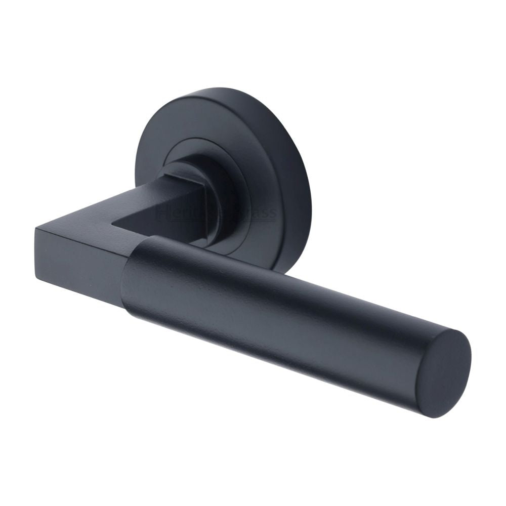 This is an image of a Heritage Brass - Door Handle Lever on Rose Bauhaus Design Matt Black Finish, v2259-bkmt that is available to order from T.H Wiggans Ironmongery in Kendal.