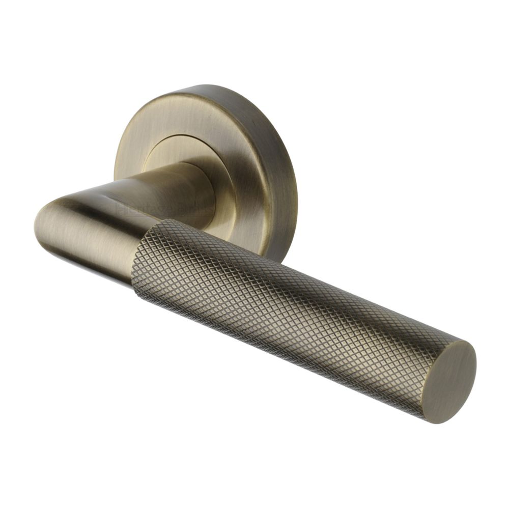 This is an image of a Heritage Brass - Door Handle Lever Latch on Round Rose Bauhaus Mitre Knurled Des, v2272-at that is available to order from T.H Wiggans Ironmongery in Kendal.