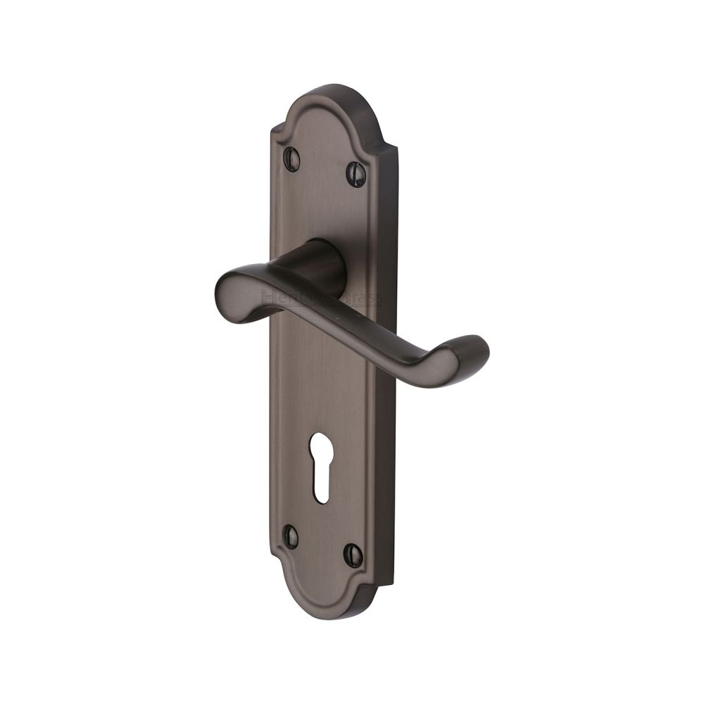 This is an image of a Heritage Brass - Door Handle Lever Lock Meridian Design Matt Bronze Finish, v300-mb that is available to order from T.H Wiggans Ironmongery in Kendal.