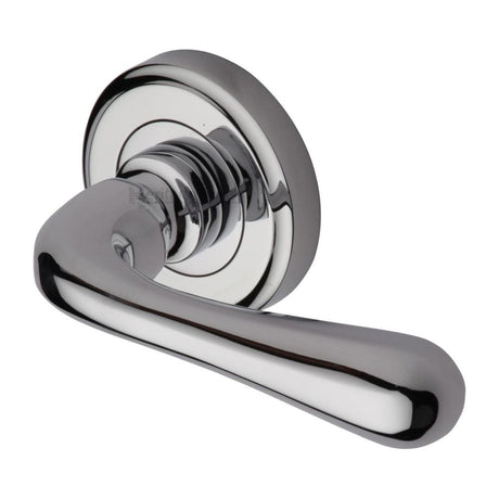 This is an image of a Heritage Brass - Door Handle Lever Latch on Round Rose Charlbury Design Polished Chr, v3020-pc that is available to order from T.H Wiggans Ironmongery in Kendal.