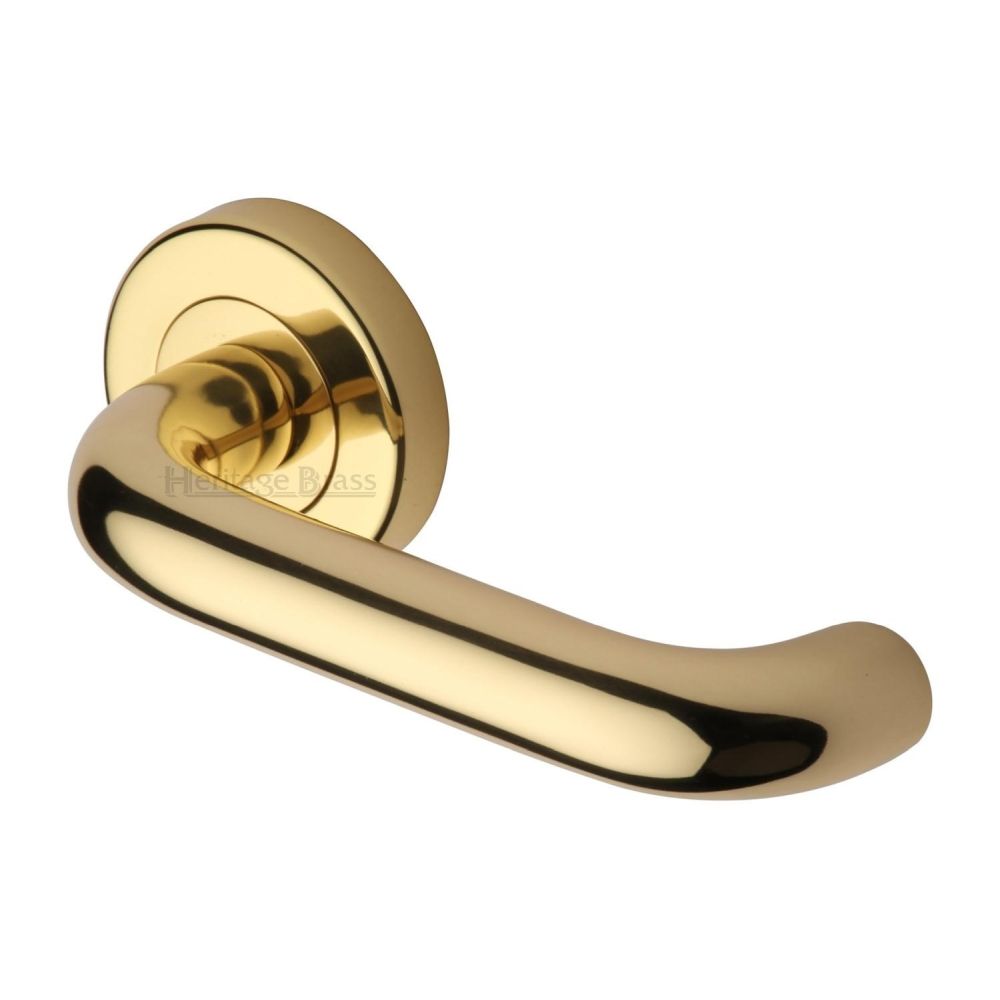 This is an image of a Heritage Brass - Door Handle Lever Latch on Round Rose Harmony Design Polished Brass, v3090-pb that is available to order from T.H Wiggans Ironmongery in Kendal.