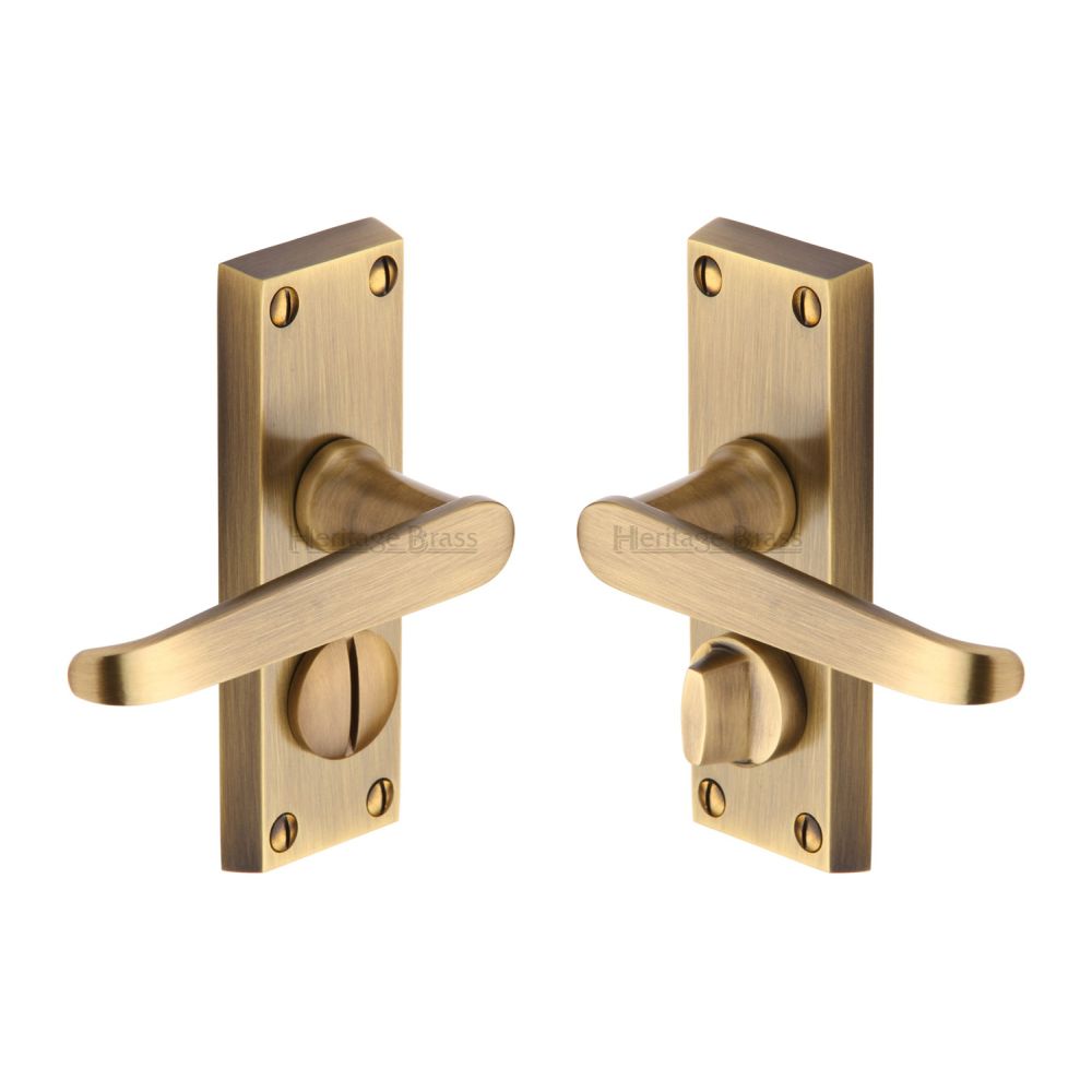 This is an image of a Heritage Brass - Door Handle for Privacy Set Victoria Short Design Antique Brass Fi, v3935-at that is available to order from T.H Wiggans Ironmongery in Kendal.