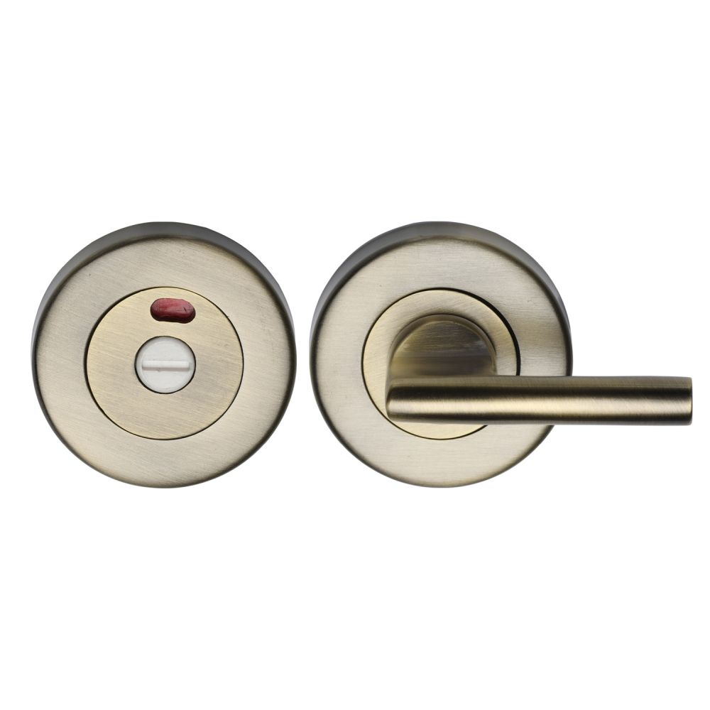 This is an image of a Heritage Brass - Indicator Turn & Release for Bathroom Doors Antique Brass Finish, v4048-at that is available to order from T.H Wiggans Ironmongery in Kendal.