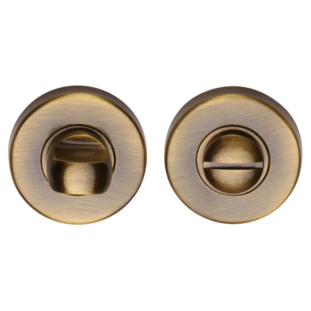 This is an image of a Heritage Brass - Thumbturn & Emergency Release Antique Brass Finish, v4049-at that is available to order from T.H Wiggans Ironmongery in Kendal.
