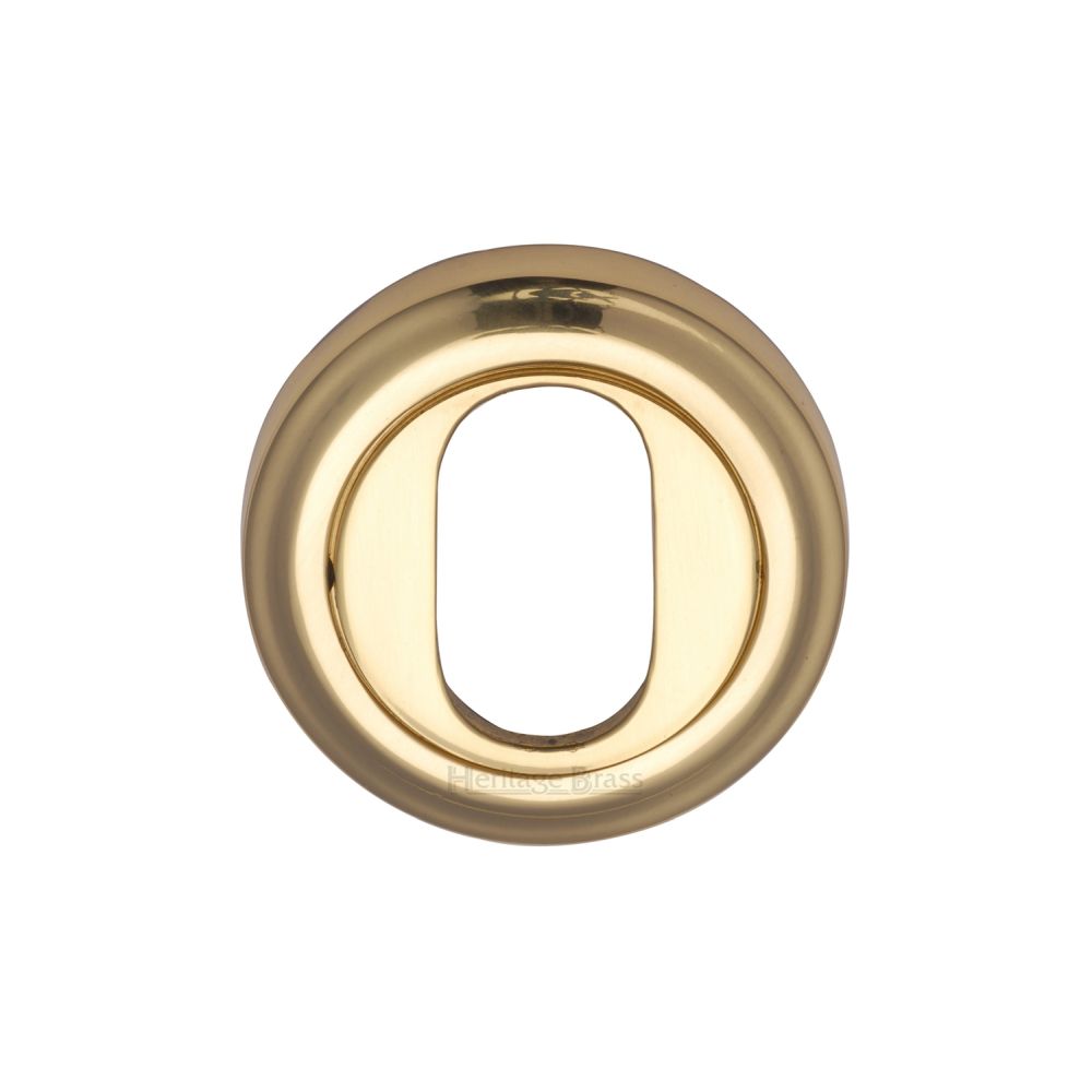 This is an image of a Heritage Brass - Oval Profile Cylinder Escutcheon Polished Brass Finish, v5010-pb that is available to order from T.H Wiggans Ironmongery in Kendal.