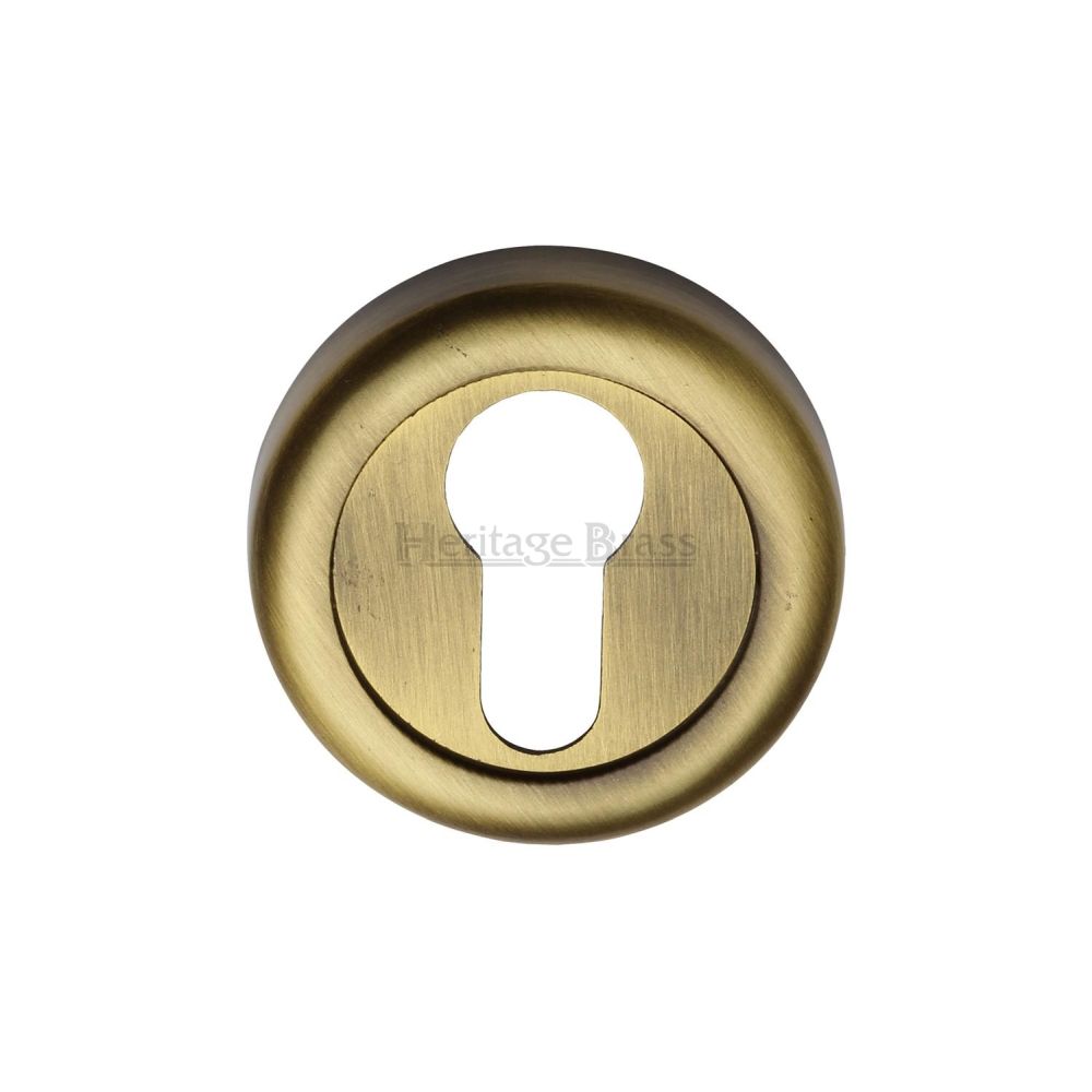 This is an image of a Heritage Brass - Euro Profile Cylinder Escutcheon Antique Brass Finish, v6724-at that is available to order from T.H Wiggans Ironmongery in Kendal.