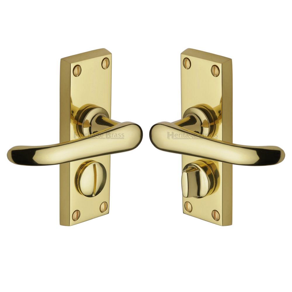 This is an image of a Heritage Brass - Door Handle for Privacy Set Windsor Short Design Polished Brass Fin, v735-pb that is available to order from T.H Wiggans Ironmongery in Kendal.