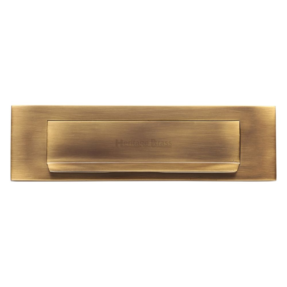 This is an image of a Heritage Brass - Gravity Letterplate 280 x 80mm - Antique Brass Finish, v842-at that is available to order from T.H Wiggans Ironmongery in Kendal.