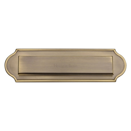 This is an image of a Heritage Brass - Gravity 11" Letterplate Antique Brass finish, v843-at that is available to order from T.H Wiggans Ironmongery in Kendal.