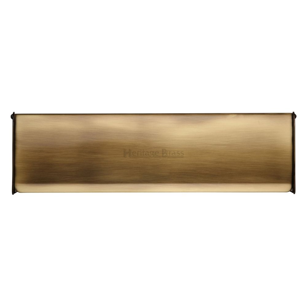 This is an image of a Heritage Brass - Interior Letterflap 11 3/4" x 3 1/2"Antique Brass Finish, v860-299-at that is available to order from T.H Wiggans Ironmongery in Kendal.