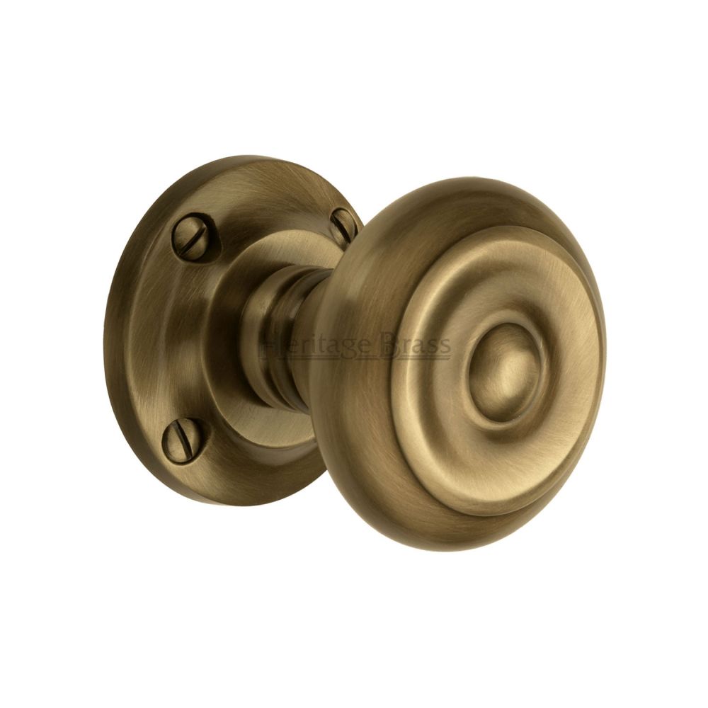 This is an image of a Heritage Brass - Mortice Knob on Rose Aylesbury Design Antique Brass Finish, v872-at that is available to order from T.H Wiggans Ironmongery in Kendal.
