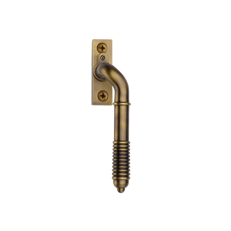 This is an image of a Heritage Brass - Lockable Reeded Espagnolette Right Handed Antique Brass Finish, v895l-rh-at that is available to order from T.H Wiggans Ironmongery in Kendal.