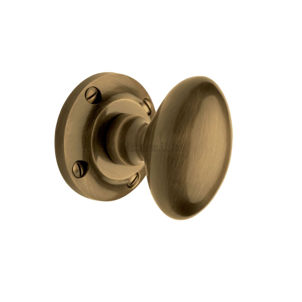 This is an image of a Heritage Brass - Mortice Knob on Rose Suffolk Design Antique Brass Finish, v960-at that is available to order from T.H Wiggans Ironmongery in Kendal.