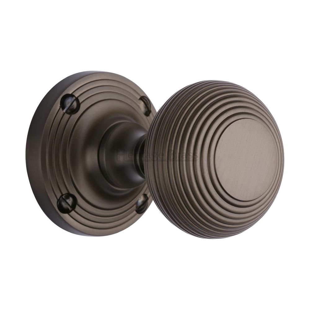 This is an image of a Heritage Brass - Mortice Knob on Rose Reeded Design Matt Bronze Finish, v971-mb that is available to order from T.H Wiggans Ironmongery in Kendal.