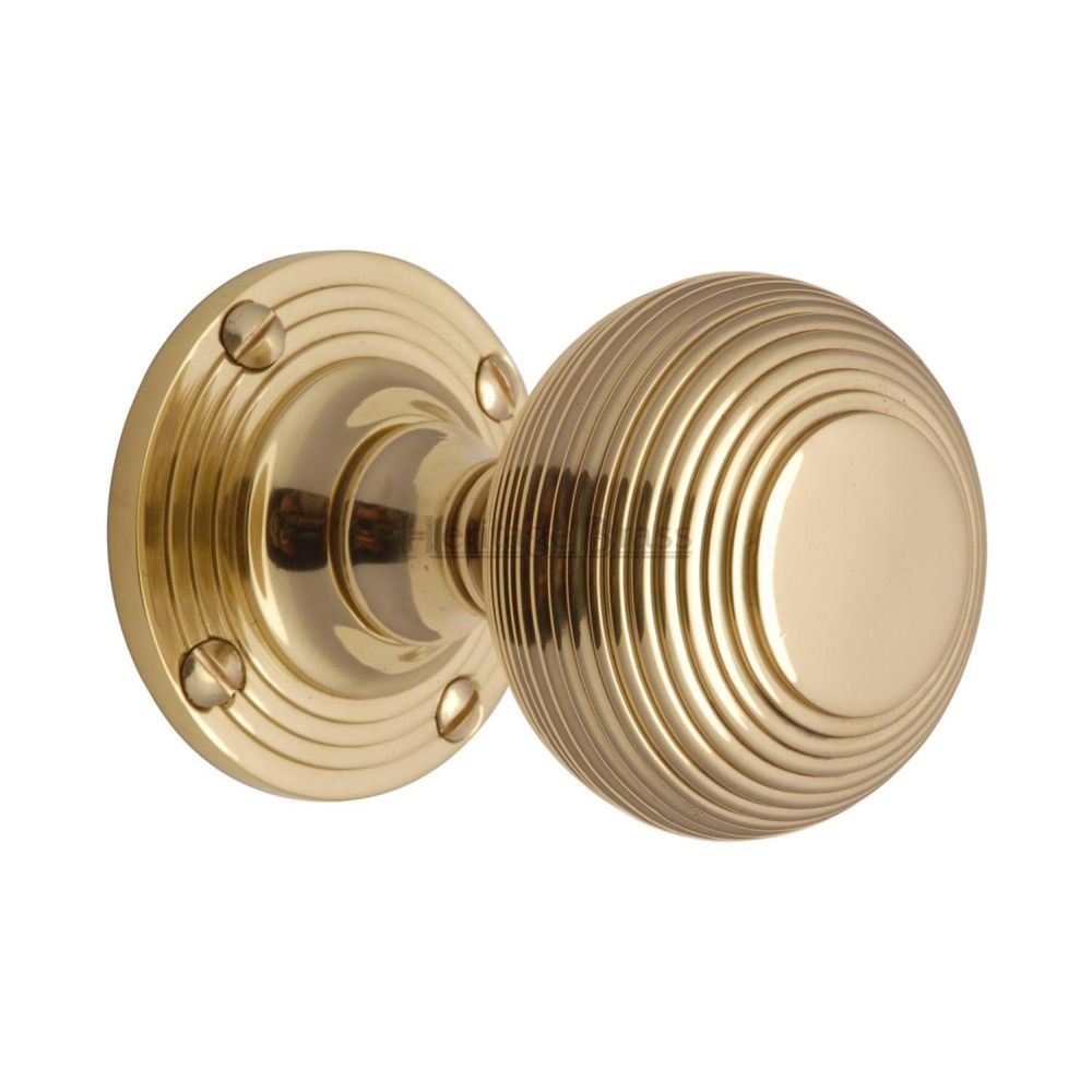 This is an image of a Heritage Brass - Mortice Knob on Rose Reeded Design Polished Brass Finish, v971-pb that is available to order from T.H Wiggans Ironmongery in Kendal.