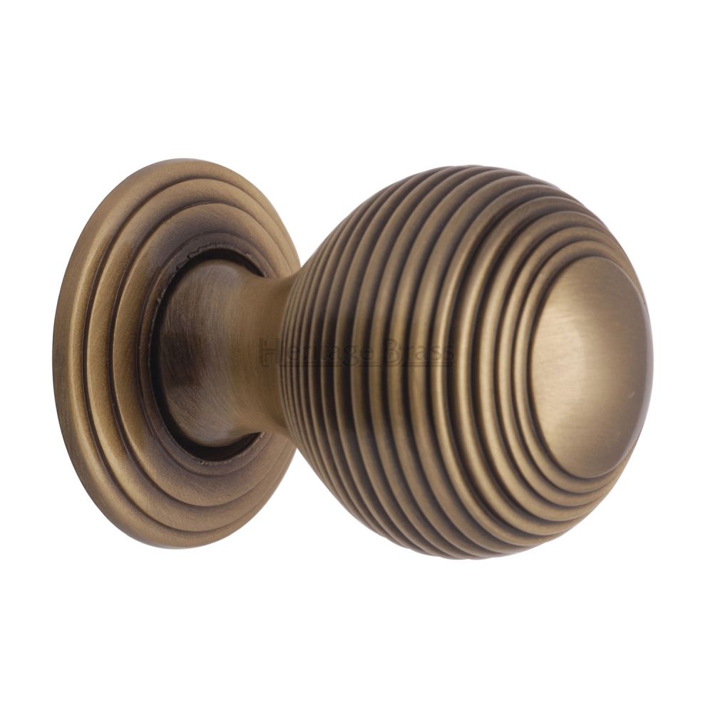 This is an image of a Heritage Brass - Cabinet Knob Reeded Design 32mm Antique Brass Finish, v973-32-at that is available to order from T.H Wiggans Ironmongery in Kendal.