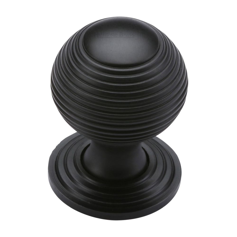 This is an image of a Heritage Brass - Cabinet Knob Reeded Design 32mm Matt Black Finish, v973-32-bkmt that is available to order from T.H Wiggans Ironmongery in Kendal.