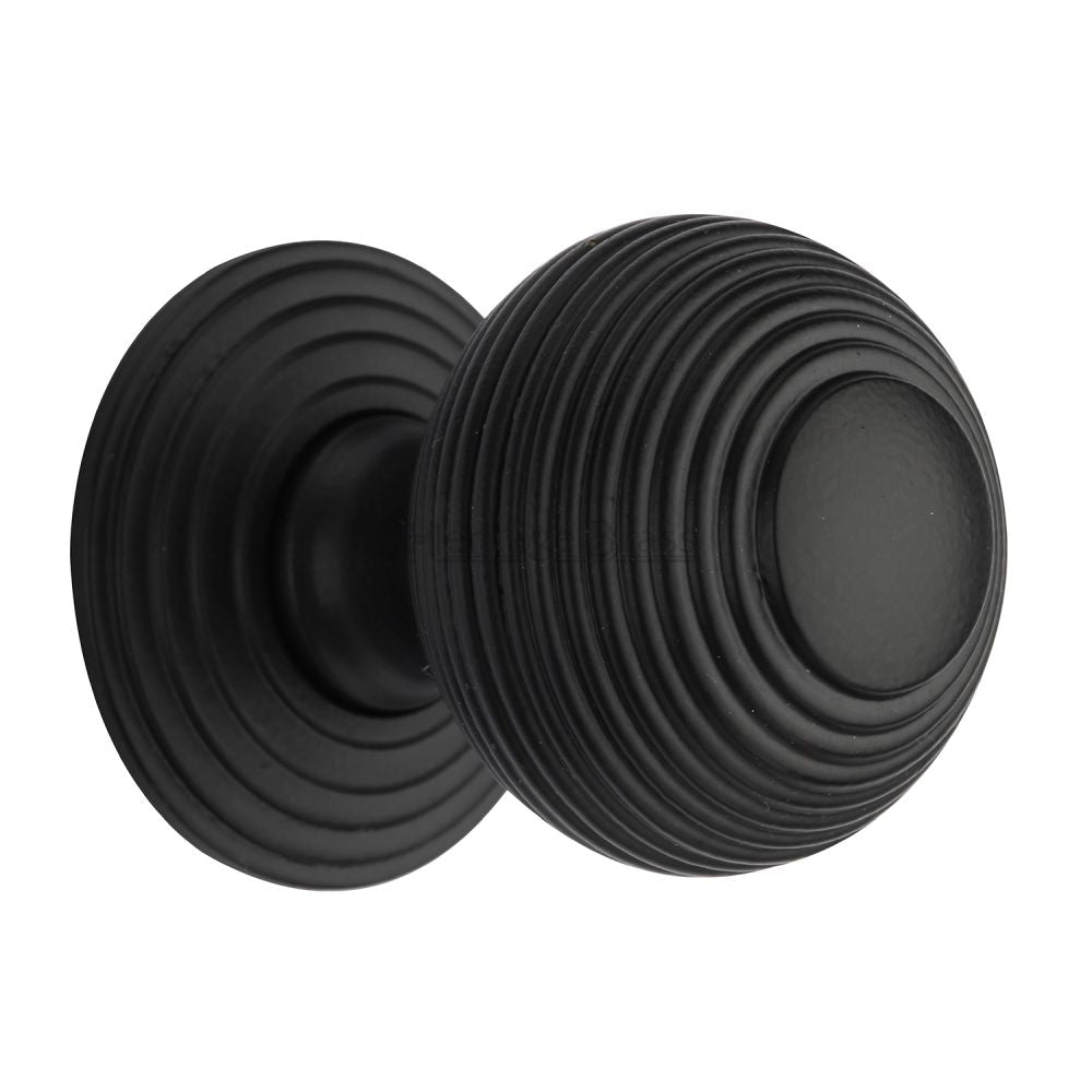 This is an image of a Heritage Brass - Cabinet Knob Reeded Design 38mm Matt Black Finish, v973-38-bkmt that is available to order from T.H Wiggans Ironmongery in Kendal.