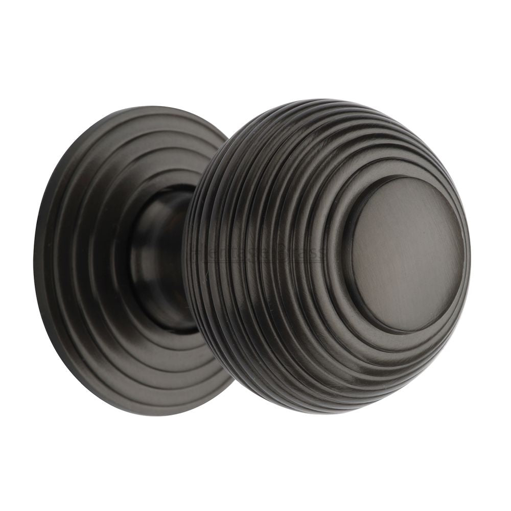 This is an image of a Heritage Brass - Cabinet Knob Reeded Design 38mm Matt Bronze Finish, v973-38-mb that is available to order from T.H Wiggans Ironmongery in Kendal.