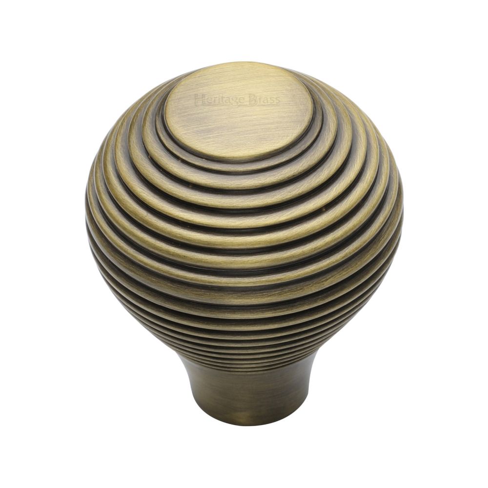 This is an image of a Heritage Brass - Cabinet Knob Reeded Design 32mm Antique Brass Finish, v974-32-at that is available to order from T.H Wiggans Ironmongery in Kendal.