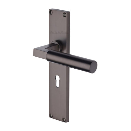 This is an image of a Heritage Brass - Bauhaus Lever Lock Door Handle on 200mm Plate Matt Bronze finish, vt6300-mb that is available to order from T.H Wiggans Ironmongery in Kendal.